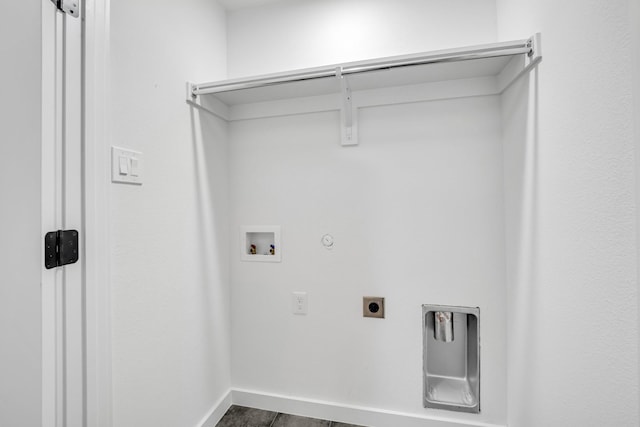 5806 Bryan Pkwy Unit 4, Dallas, TX 75206 - washroom with hookup for an electric dryer, hookup for a gas dryer, washer hookup, baseboards, and dark tile patterned flooring