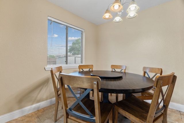 1413 Rockbrook St, Lancaster, TX 75134 - dining room with baseboards, a chandelier, and light tile patterned floors