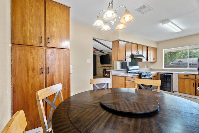 1413 Rockbrook St, Lancaster, TX 75134 - dining room with wine cooler and a chandelier