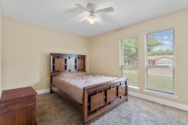 1413 Rockbrook St, Lancaster, TX 75134 - carpeted bedroom with baseboards and ceiling fan