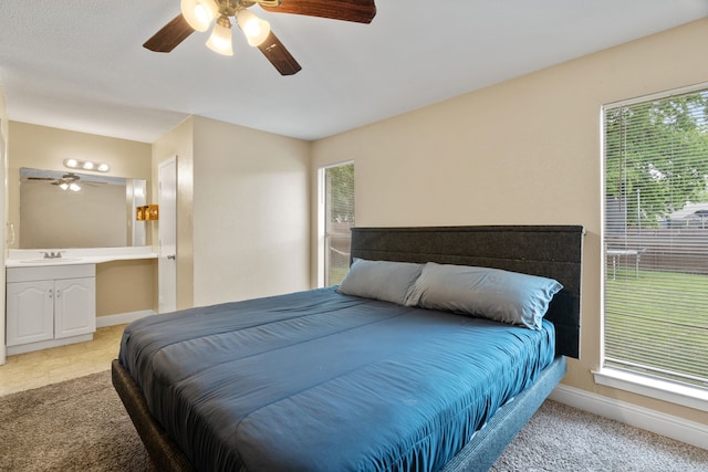 1413 Rockbrook St, Lancaster, TX 75134 - bedroom with a sink, baseboards, ceiling fan, and ensuite bath