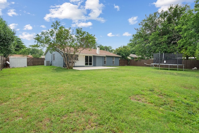 1413 Rockbrook St, Lancaster, TX 75134 - view of yard featuring a trampoline, a patio, and central air condition unit
