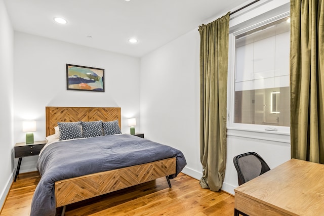 1928 Kearney Ct, Dallas, TX 75204 - bedroom featuring light wood-type flooring, baseboards, and recessed lighting