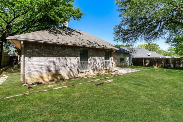 665 Cardinal Ridge Rd, Burleson, TX 76028 - rear view of property featuring brick siding, a chimney, a patio, and roof with shingles