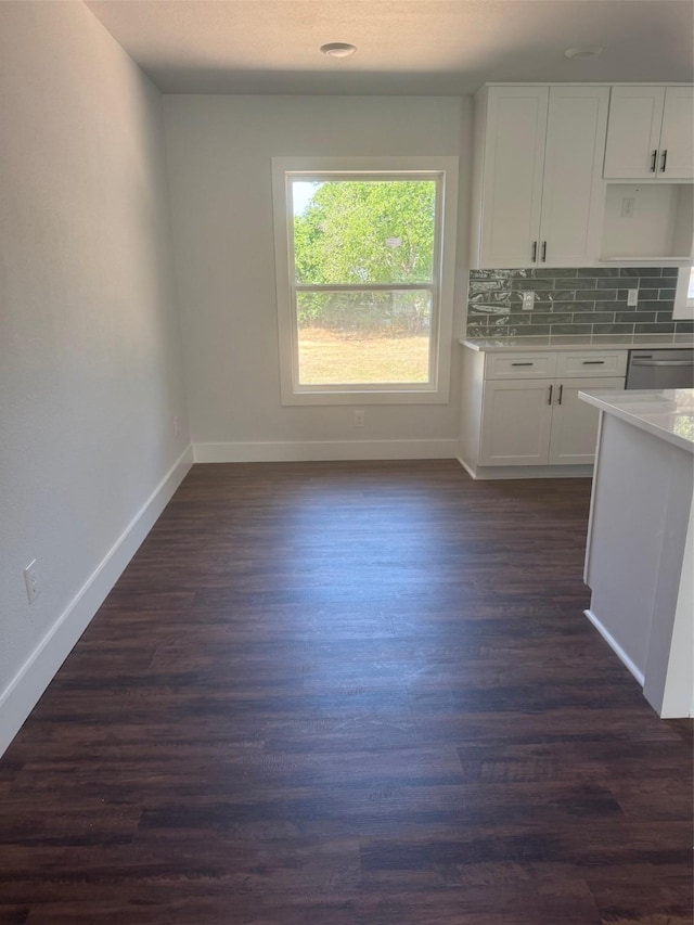 120 Live Oak Dr, Sanctuary, TX 76020 - kitchen with baseboards, dark wood-style floors, white cabinets, and tasteful backsplash