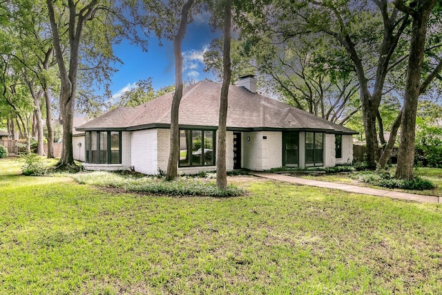 1103 Teakwood Dr, Duncanville, TX 75137 - view of front of home with brick siding and a chimney
