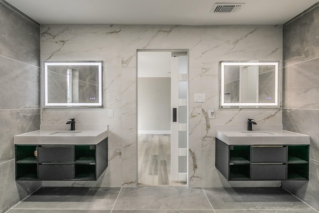 1103 Teakwood Dr, Duncanville, TX 75137 - full bathroom featuring vanity and tile walls