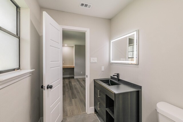 1103 Teakwood Dr, Duncanville, TX 75137 - half bath with toilet, vanity, and baseboards
