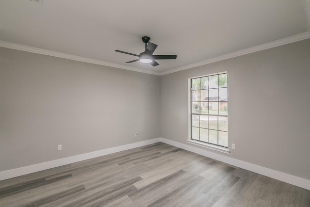 1103 Teakwood Dr, Duncanville, TX 75137 - unfurnished room featuring wood finished floors, baseboards, crown molding, and a ceiling fan