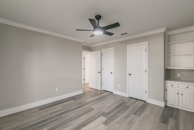 1103 Teakwood Dr, Duncanville, TX 75137 - unfurnished bedroom with wood finished floors, ornamental molding, baseboards, and a ceiling fan