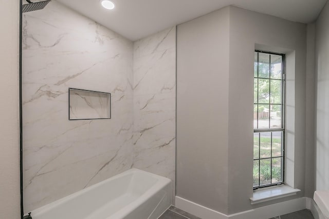 1103 Teakwood Dr, Duncanville, TX 75137 - bathroom featuring healthy amount of natural light, baseboards, and washtub / shower combination