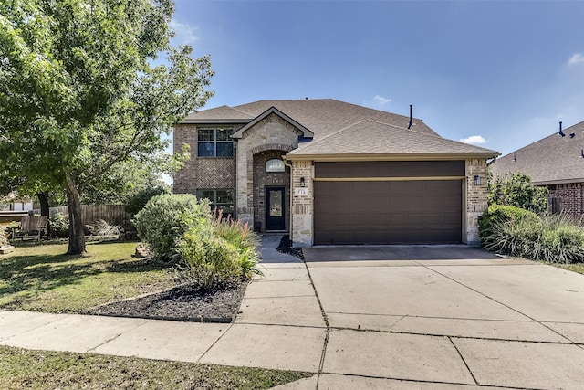 712 Saddleway Dr, Fort Worth, TX 76179 - french provincial home with brick siding, a garage, driveway, and roof with shingles