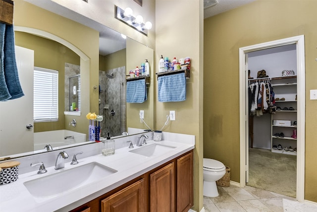 712 Saddleway Dr, Fort Worth, TX 76179 - full bathroom with a stall shower, tile patterned floors, double vanity, a walk in closet, and a garden tub