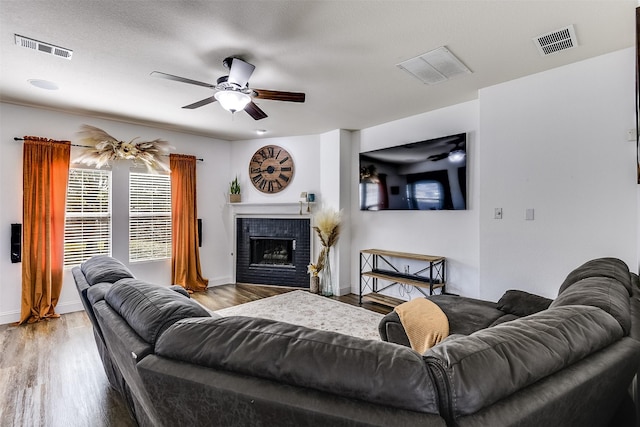 712 Saddleway Dr, Fort Worth, TX 76179 - living room with ceiling fan, wood finished floors, and a fireplace