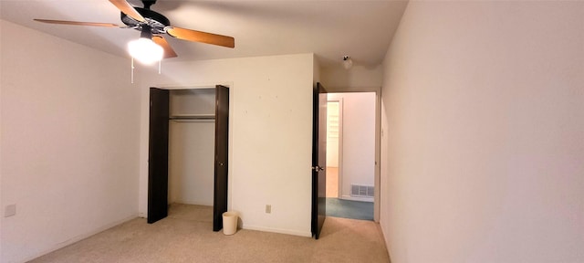 6121 Over Lake Dr, Fort Worth, TX 76135 - unfurnished bedroom featuring light colored carpet, a closet, and a ceiling fan
