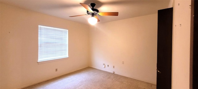 6121 Over Lake Dr, Fort Worth, TX 76135 - spare room with light carpet, a ceiling fan, and baseboards
