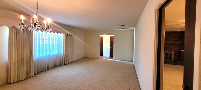 6121 Over Lake Dr, Fort Worth, TX 76135 - carpeted empty room with a chandelier