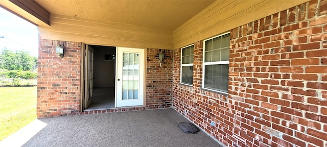 6121 Over Lake Dr, Fort Worth, TX 76135 - entrance to property with brick siding and a patio
