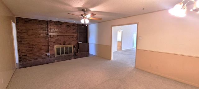 6121 Over Lake Dr, Fort Worth, TX 76135 - unfurnished living room with carpet floors, ceiling fan, a brick fireplace, a textured ceiling, and baseboards