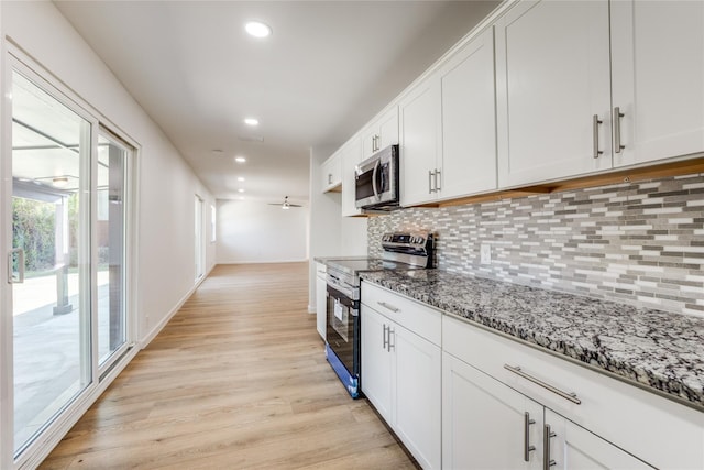 202 Kenway St, Rockwall, TX 75087 - kitchen featuring appliances with stainless steel finishes, light wood finished floors, decorative backsplash, stone counters, and recessed lighting
