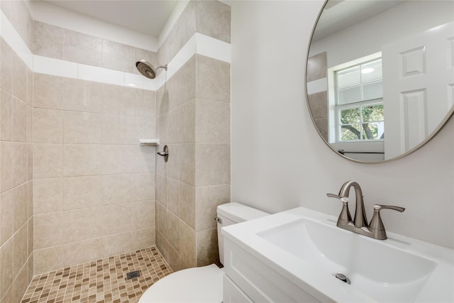 202 Kenway St, Rockwall, TX 75087 - full bathroom with a tile shower, toilet, and vanity