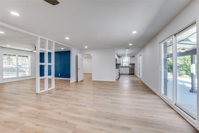 202 Kenway St, Rockwall, TX 75087 - unfurnished living room with ceiling fan, plenty of natural light, recessed lighting, light wood finished floors, and baseboards
