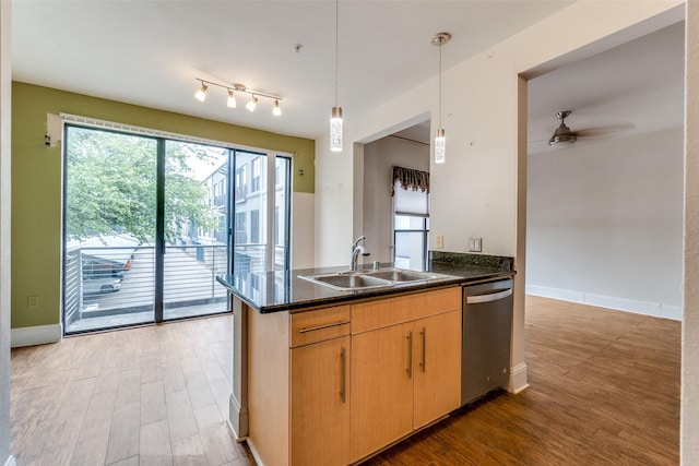 4414 Cedar Springs Rd Unit 226, Dallas, TX 75219 - kitchen with dishwasher, a sink, a ceiling fan, a peninsula, and plenty of natural light