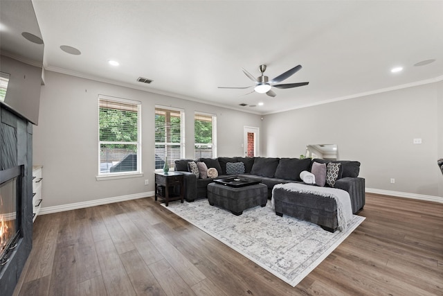 3516 Horace Ave, Fort Worth, TX 76244 - living room with wood finished floors, ceiling fan, a glass covered fireplace, baseboards, and crown molding