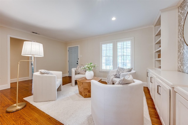7107 La Vista Dr, Dallas, TX 75214 - living area with wood finished floors, crown molding, and baseboards