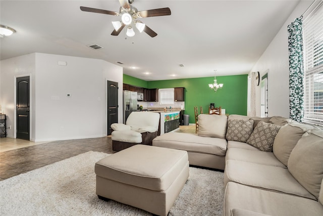 2841 Pacifico Way, Fort Worth, TX 76111 - living area with a chandelier, light tile patterned floors, ceiling fan, and healthy amount of natural light