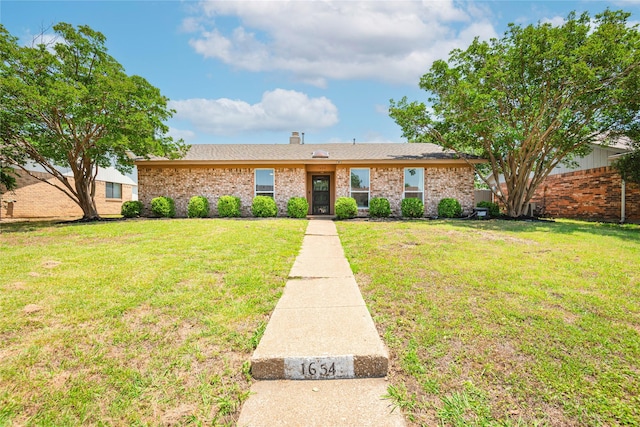 1654 Clarendon Dr, Lewisville, TX 75067 - ranch-style home with brick siding and a chimney