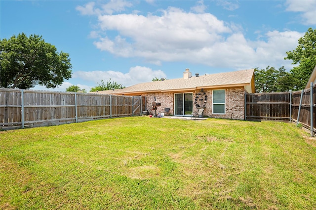 1654 Clarendon Dr, Lewisville, TX 75067 - back of property with brick siding and a chimney