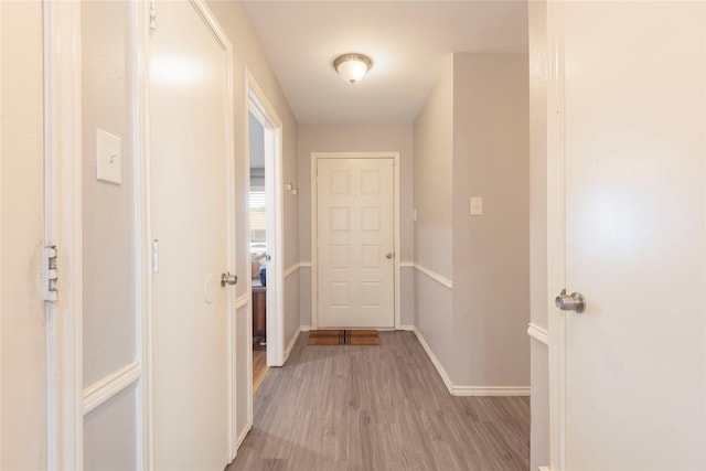 1654 Clarendon Dr, Lewisville, TX 75067 - corridor featuring light wood-style floors and baseboards