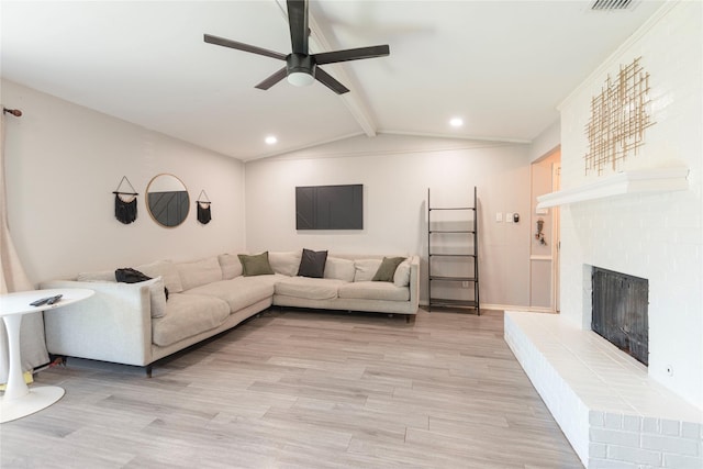 1654 Clarendon Dr, Lewisville, TX 75067 - living area featuring ceiling fan, light wood-type flooring, a brick fireplace, and recessed lighting