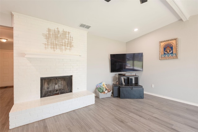 1654 Clarendon Dr, Lewisville, TX 75067 - unfurnished living room with wood finished floors, baseboards, a fireplace, and recessed lighting