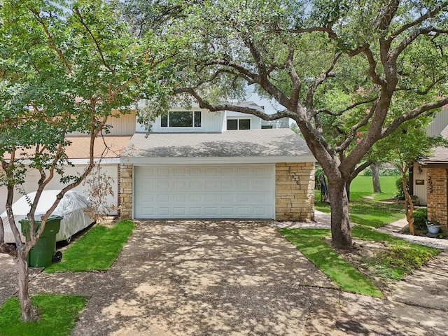 2926 Shady Lake Cir, Carrollton, TX 75006 - view of front of home with stone siding, driveway, and a garage