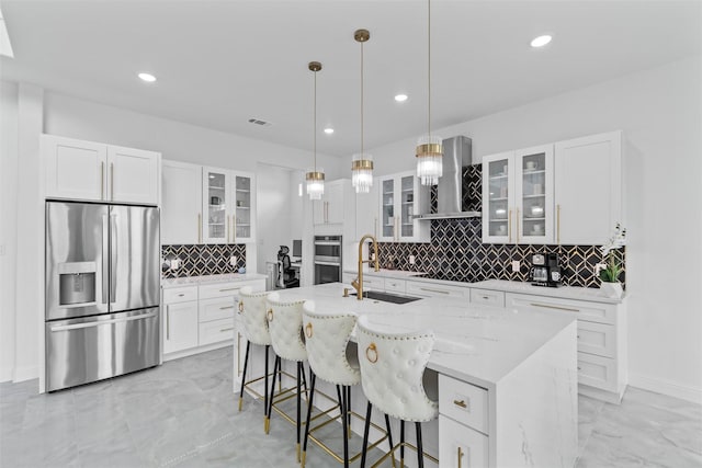 3620 Quail Ln, Arlington, TX 76016 - kitchen featuring stainless steel appliances, wall chimney range hood, light marble finish floors, a sink, and tasteful backsplash