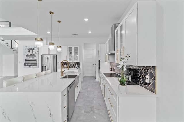 3620 Quail Ln, Arlington, TX 76016 - kitchen featuring appliances with stainless steel finishes, recessed lighting, a sink, decorative backsplash, and a large island with sink
