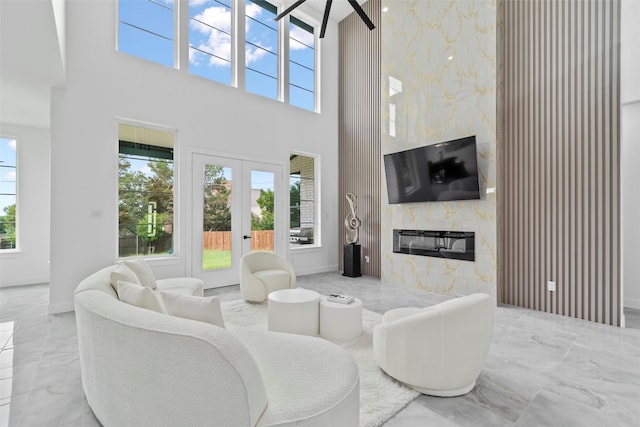 3620 Quail Ln, Arlington, TX 76016 - living area with a high ceiling, plenty of natural light, marble tiled floors, and a high end fireplace