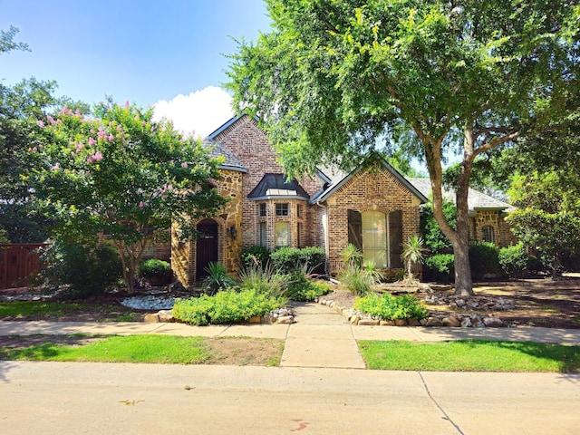 8512 Arbor Creek Ln, Mckinney, TX 75072 - tudor house featuring brick siding