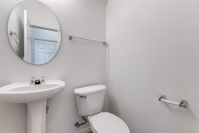 7001 Van Gogh Dr, Plano, TX 75093 - half bathroom featuring toilet and a sink