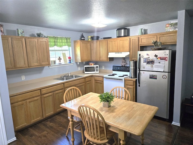 306 S Allen St, Boyd, TX 76023 - kitchen featuring white appliances, under cabinet range hood, dark wood-style floors, light countertops, and a textured ceiling