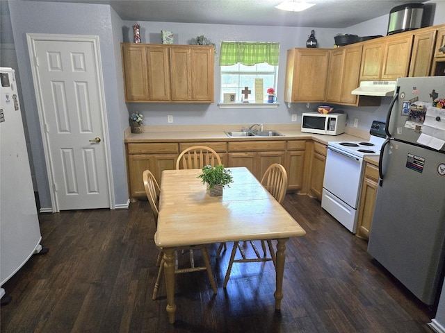 306 S Allen St, Boyd, TX 76023 - kitchen featuring white appliances, dark wood-style floors, light countertops, and under cabinet range hood
