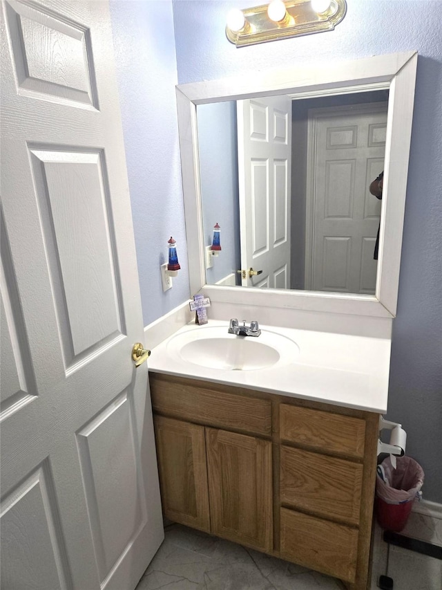 306 S Allen St, Boyd, TX 76023 - bathroom with vanity and marble look tile flooring