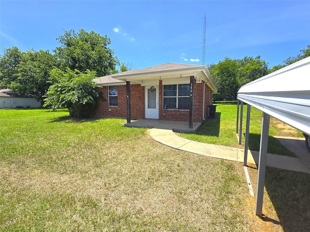 306 S Allen St, Boyd, TX 76023 - view of front of home with a front yard and brick siding