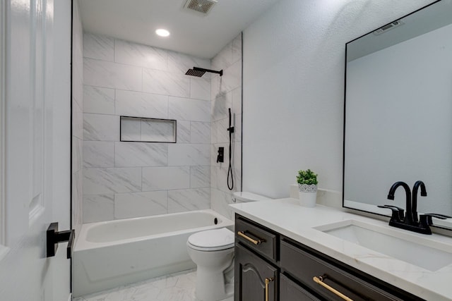 15525 Western Trl, Frisco, TX 75035 - full bathroom with vanity, marble look tiles, toilet, washtub / shower combination, and recessed lighting