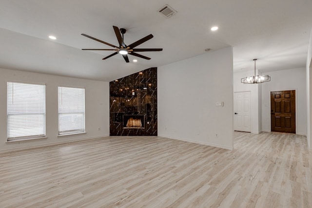 15525 Western Trl, Frisco, TX 75035 - unfurnished living room featuring light wood-style floors, ceiling fan, a chandelier, recessed lighting, and baseboards
