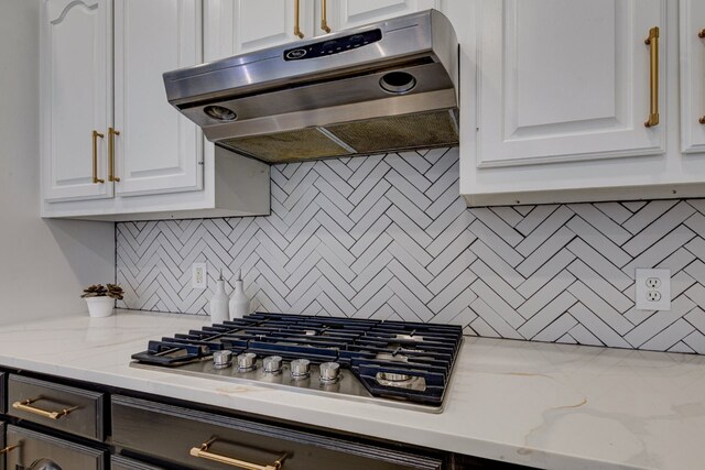 15525 Western Trl, Frisco, TX 75035 - kitchen with range hood, white cabinets, decorative backsplash, and stainless steel gas cooktop