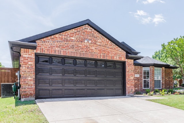15525 Western Trl, Frisco, TX 75035 - view of front facade featuring brick siding, driveway, and a garage