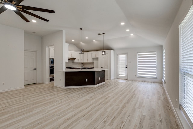 15525 Western Trl, Frisco, TX 75035 - kitchen with open floor plan, a sink, lofted ceiling, a ceiling fan, and a kitchen island with sink